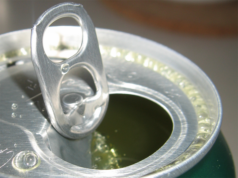 Close-up view of the opened top and interior edge of an aluminum beverage can